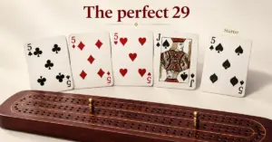 The perfect 29-point cribbage hand with three fives and the jack of spades, a five of spades starter card, and a wooden scoring board with brass pegs.